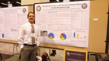 CNS researcher Eric Hazzard with his poster at Experimental Biology.