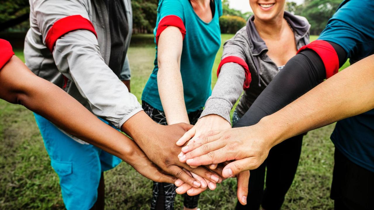 people putting hands together