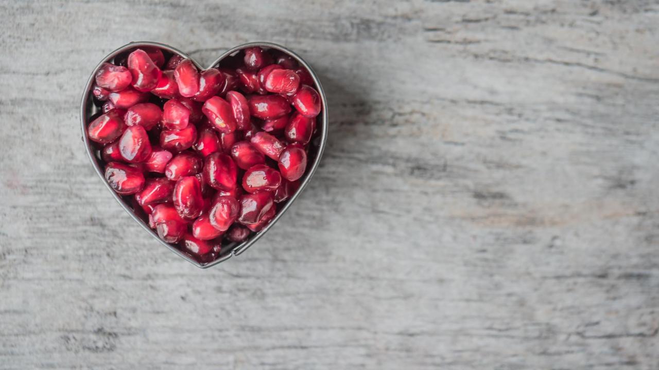 pomegranate seeds in the shape of a heart