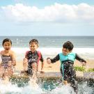 Family playing together in the water