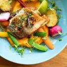 a plate of fish and vegetables