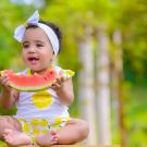 child eating watermelon