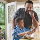 father and son packing snacks